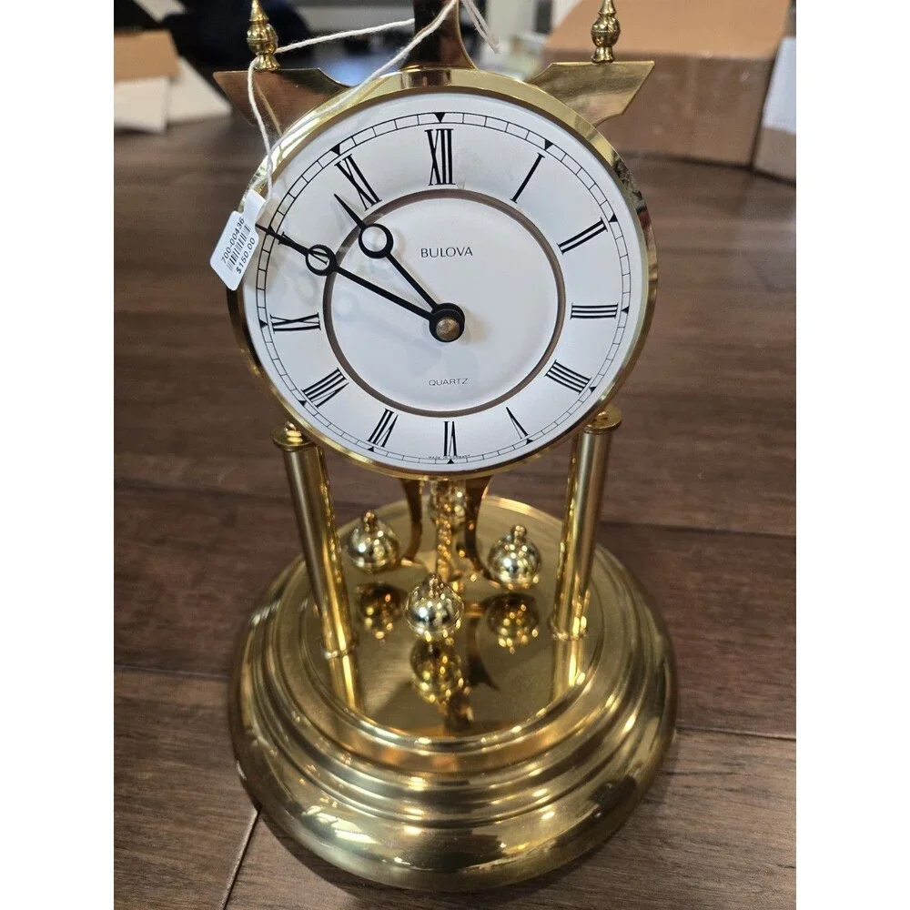 Bulova Tristan I B8818 Anniversary Clock - Glass Dome, Rotating Crystal Pendulum